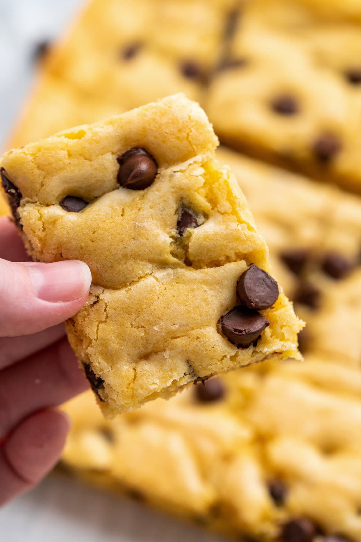 Hand holding a Cake Mix Cookie Bar