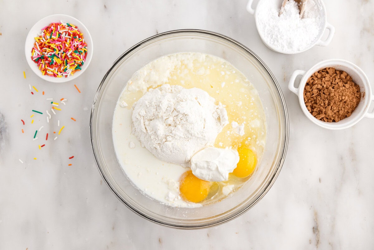 cake mix donut ingredients in a large mixing bowl