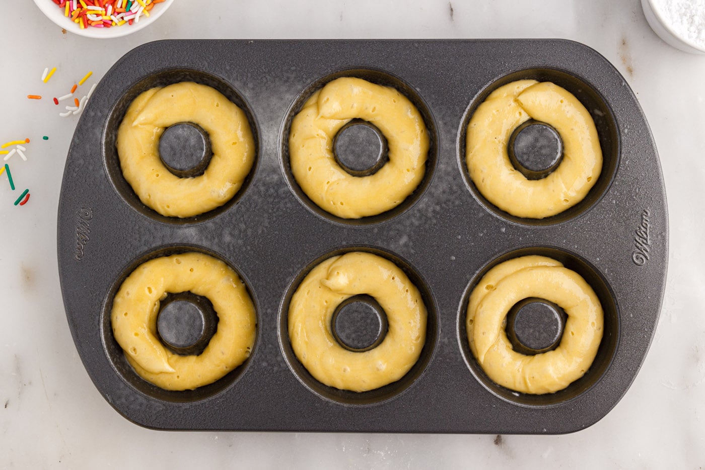 donut batter in a pan