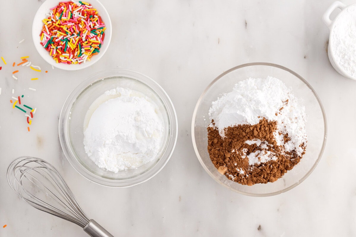 cocoa powder and powdered sugar in a bowl next to powdered sugar and milk in a bowl