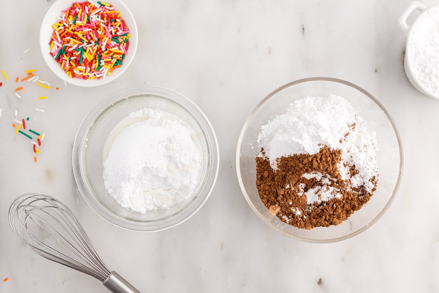cocoa powder and powdered sugar in a bowl next to powdered sugar and milk in a bowl
