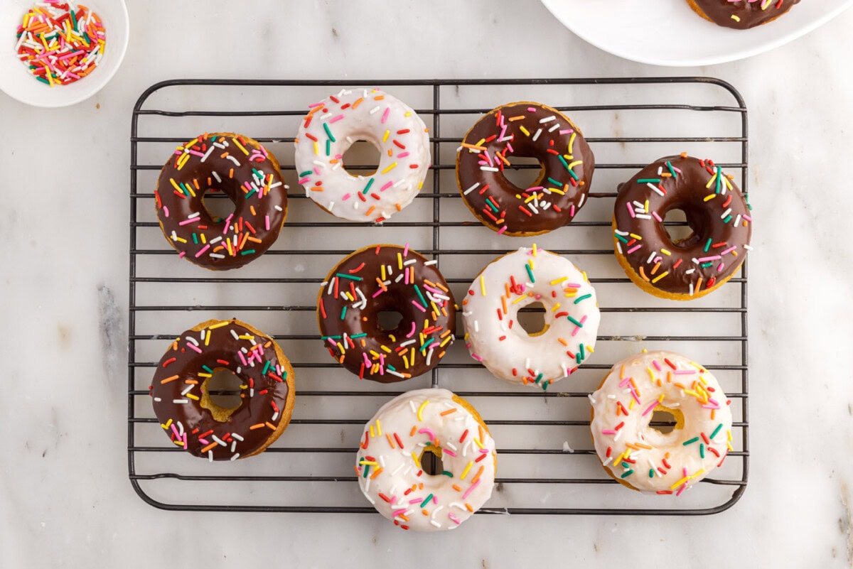 cake mix donuts with vanilla and chocolate glaze topped with sprinkles
