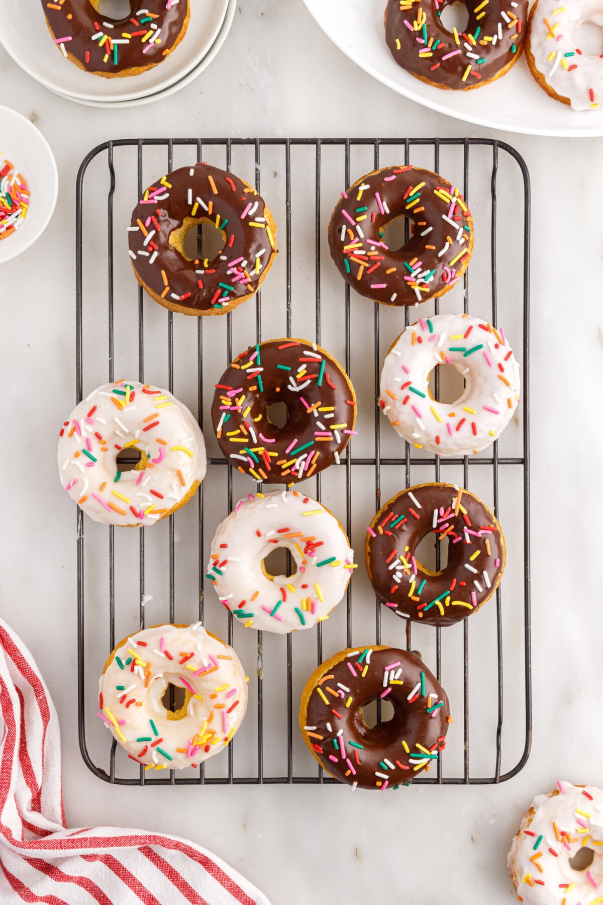 Cake Mix Donuts resting on a wire cooling rack