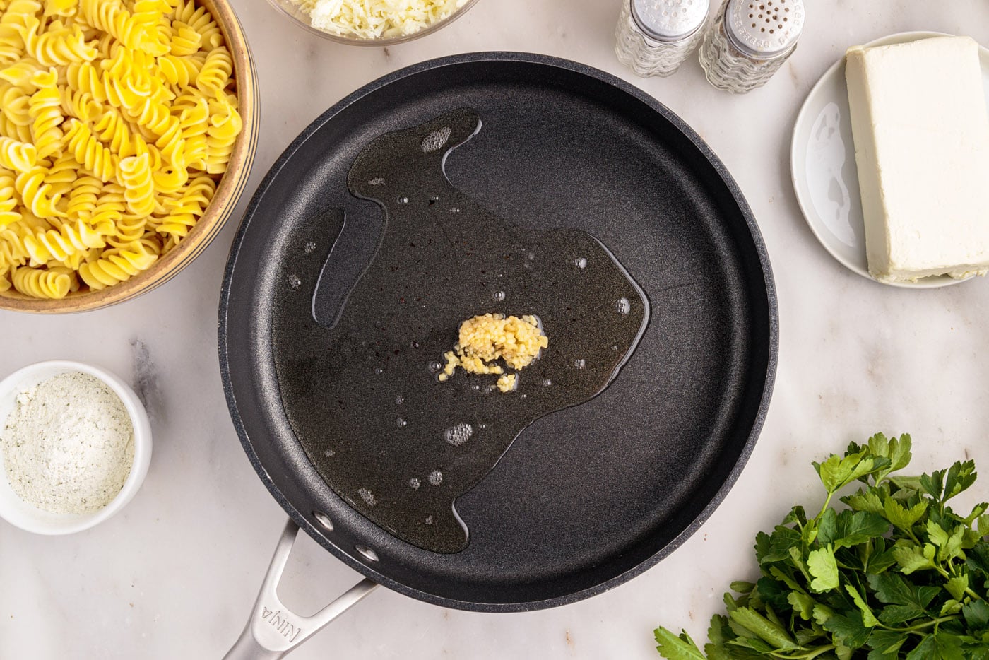 minced garlic sauteed in a skillet of oil