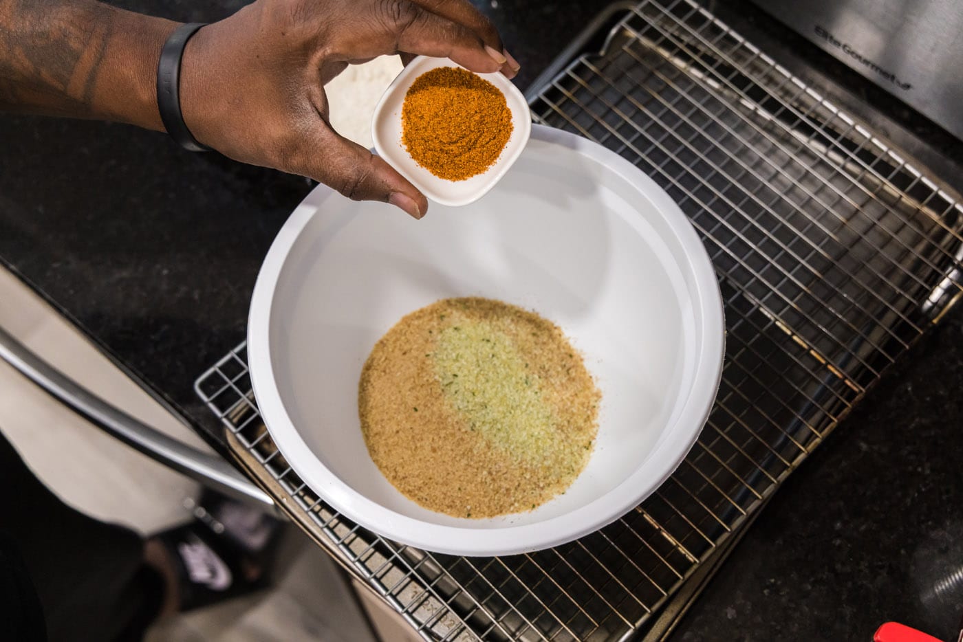 breadcrumbs, garlic salt, and old bay seasoning in a mixing bowl