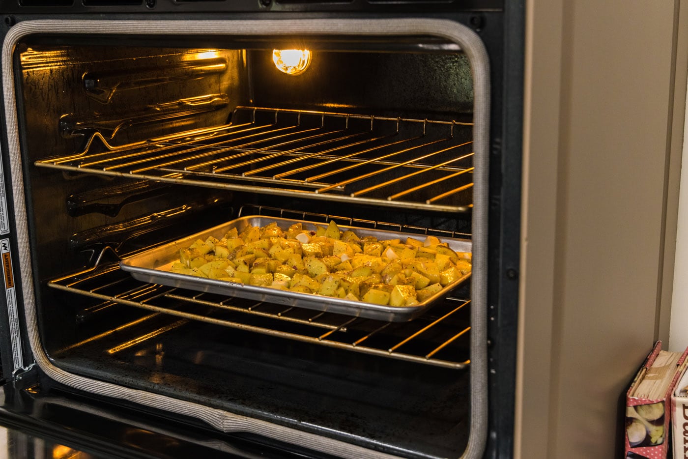 baking sheet with roasted potatoes in the oven