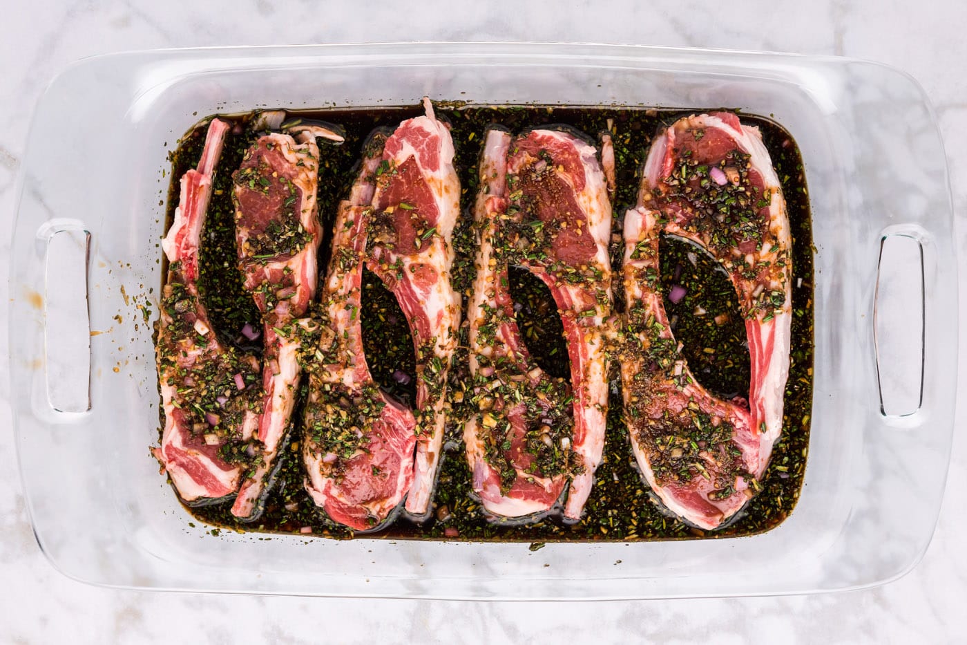 lamb chops sitting in marinade