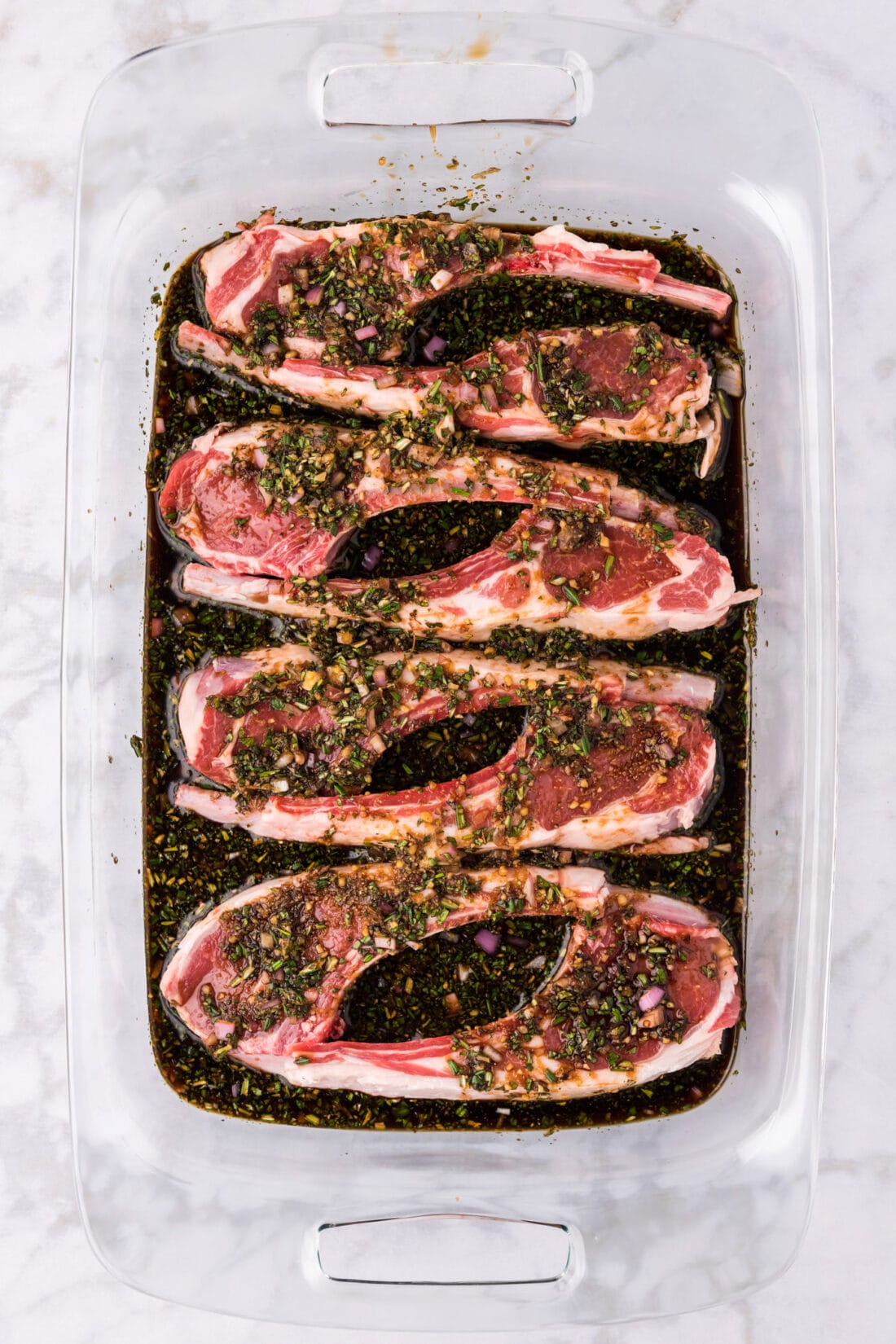 Lamb Chops and Lamb Chop Marinade sitting in a 13 x 9 pan