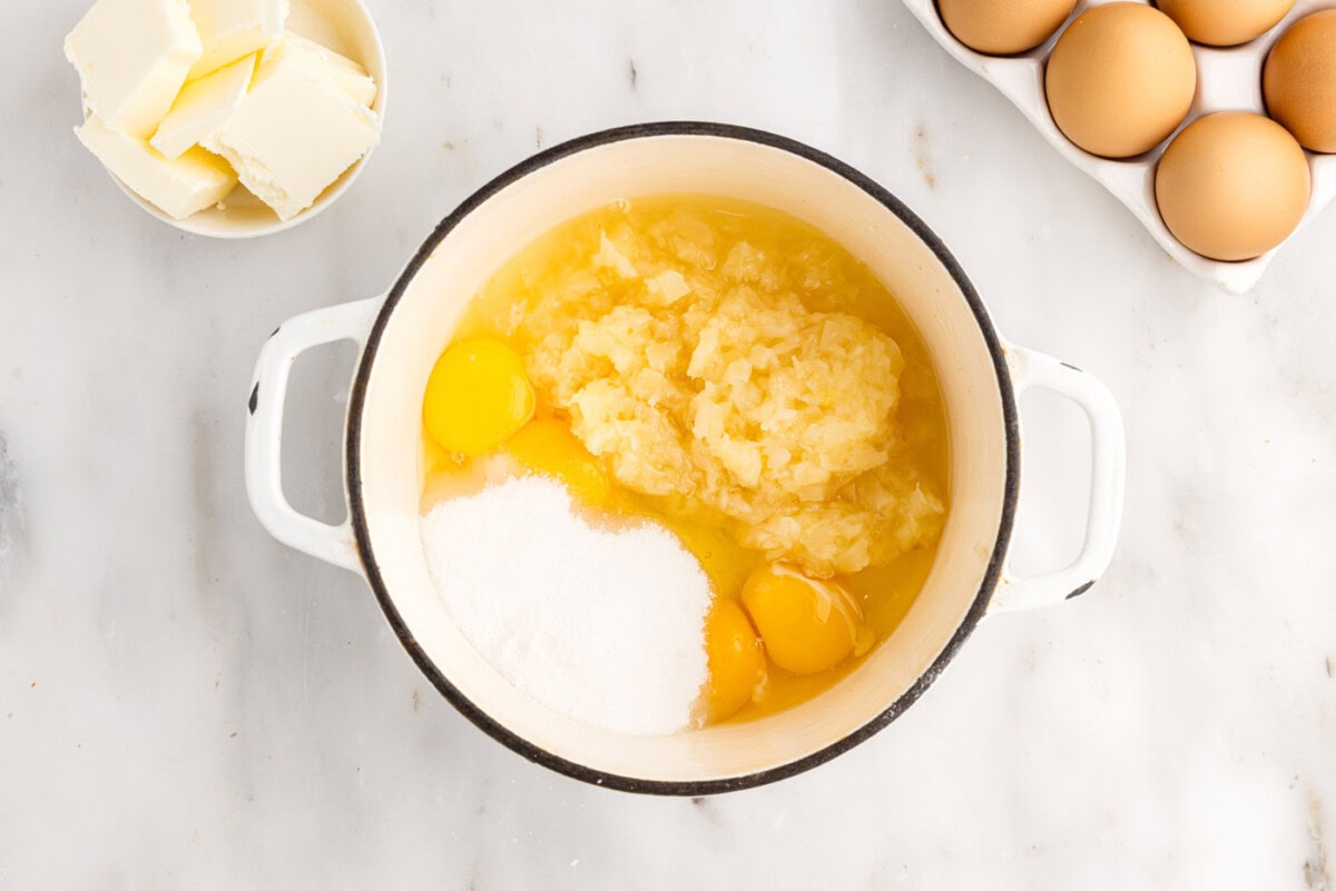 ingredients for pineapple curd in a sauce pan