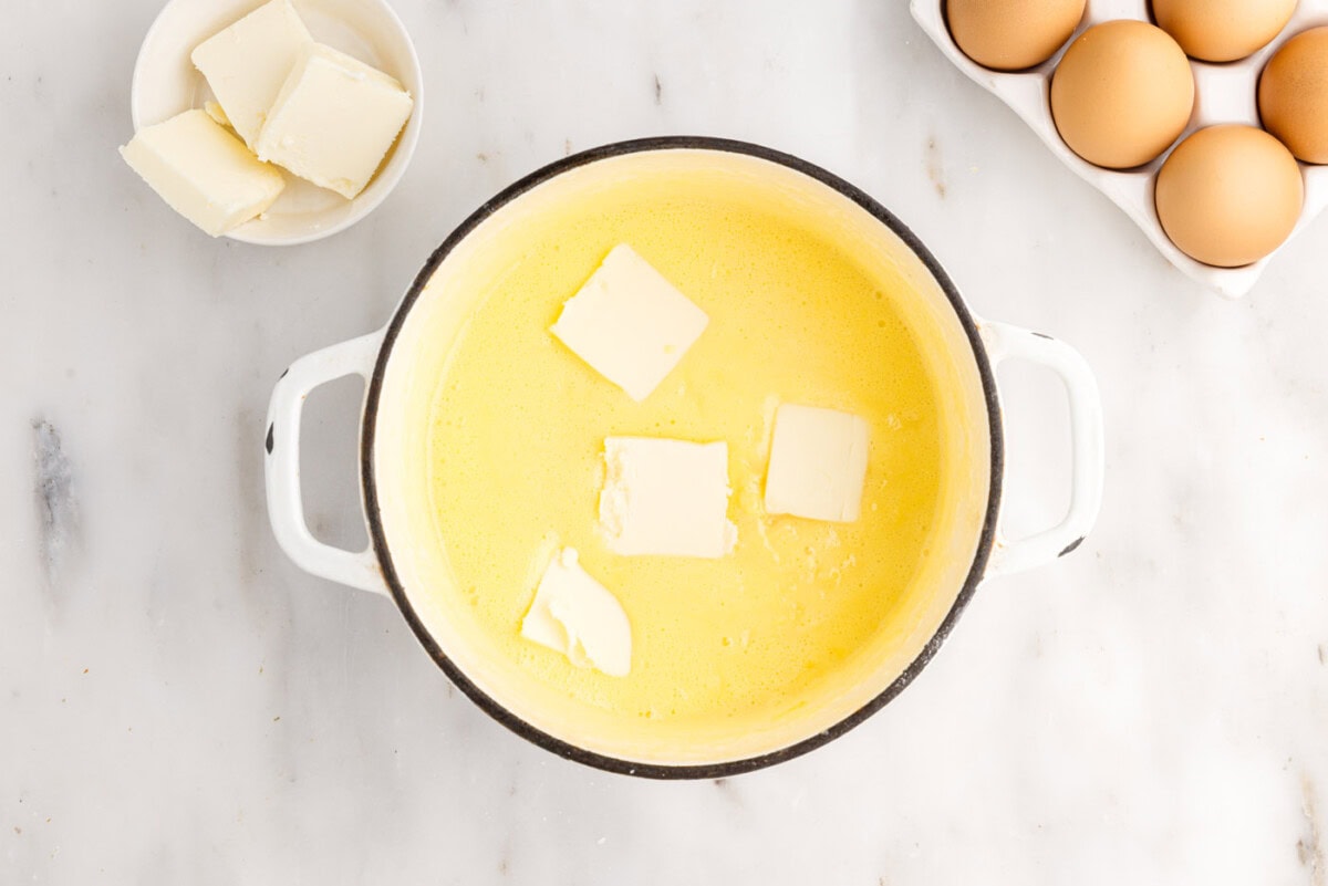 adding butter to pineapple curd