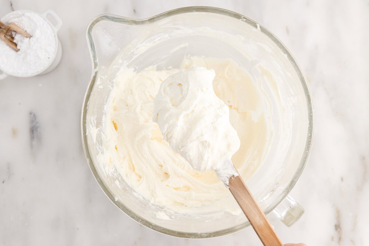 cream cheese frosting on a spatula