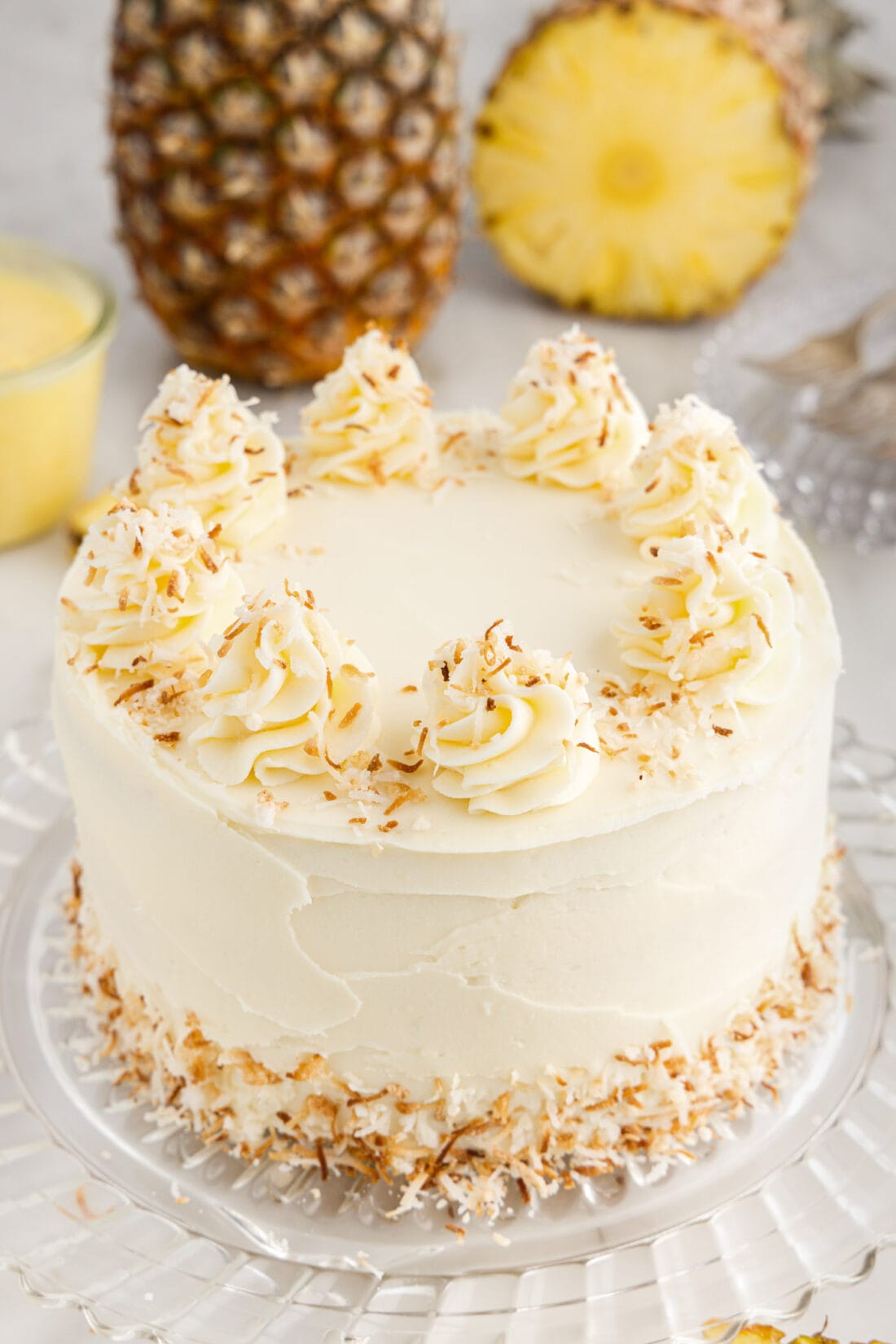 Pineapple Coconut Cake on a cake stand