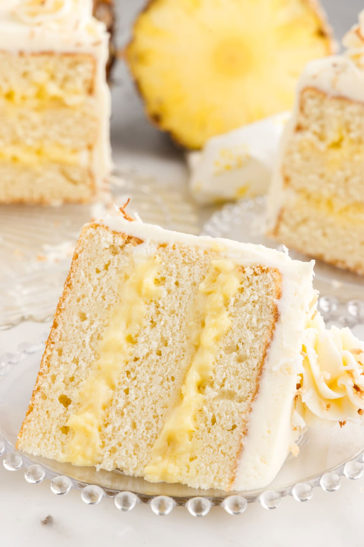 Slice of Pineapple Coconut Cake on a plate