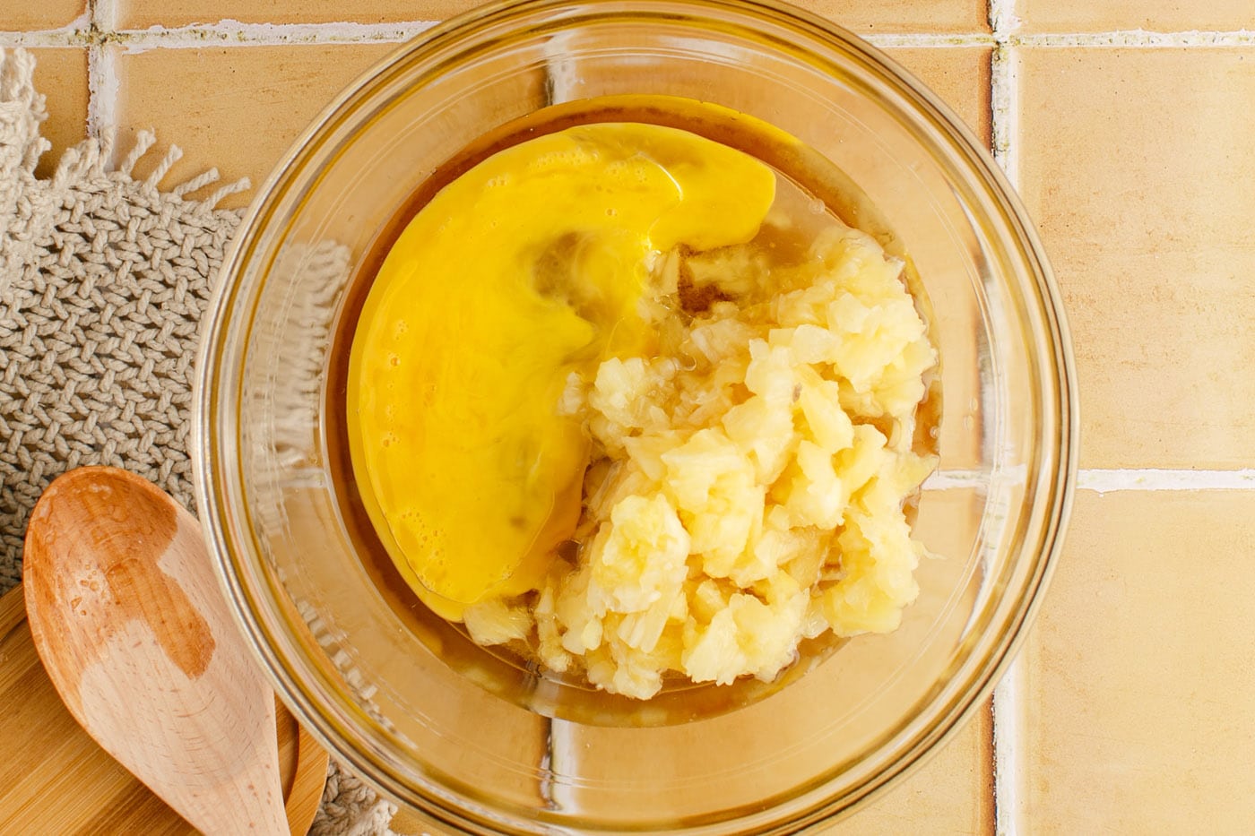 egg and pineapple added to brown sugar mixture