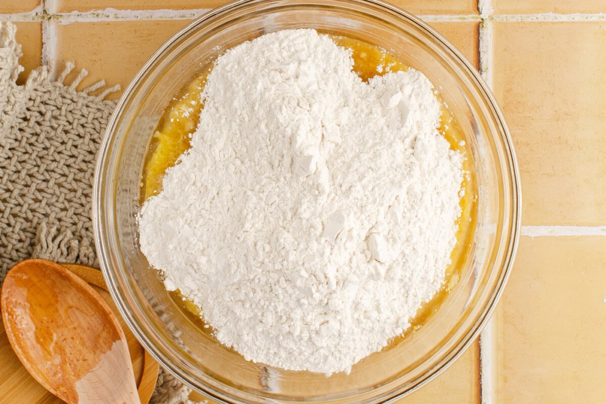 adding dry ingredients to wet ingredients for muffins