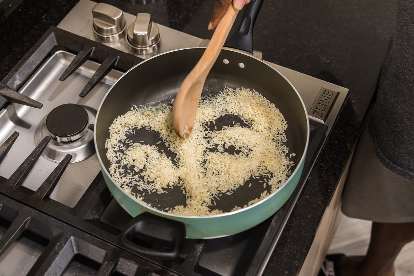browning white rice in a skillet with butter