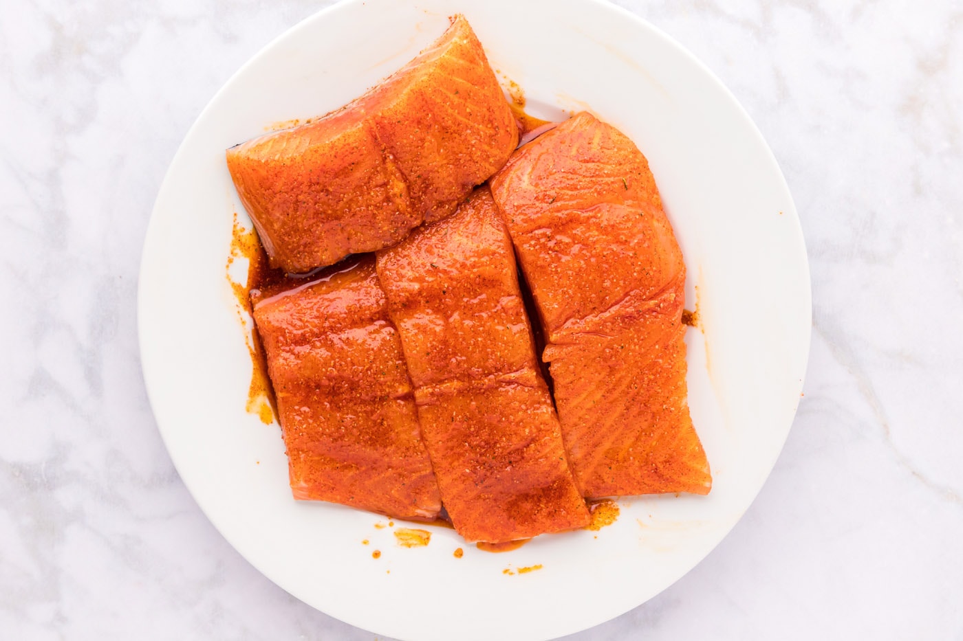 salmon filets coated in a wet rub
