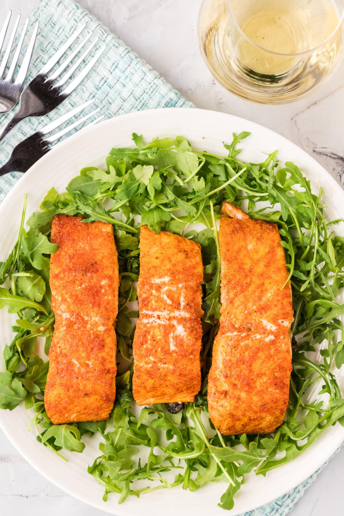 Roasted Salmon served on a bed of greens