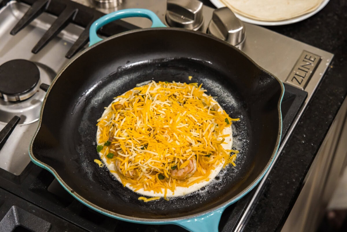 colby cheese on top of shrimp quesadilla