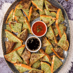 Platter of Shrimp Toast with dipping sauces in the middle