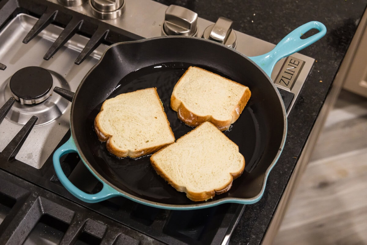 frying shrimp toast in a skillet