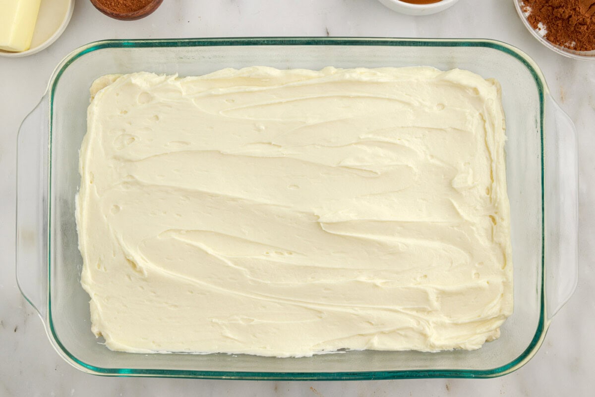 cheesecake layered on top of crescent dough in a baking dish