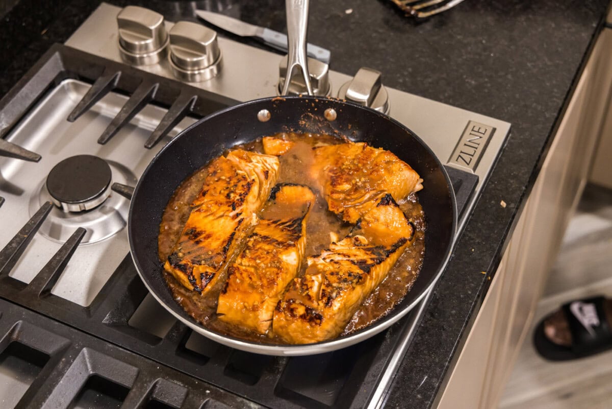 cooked teriyaki salmon in a skillet