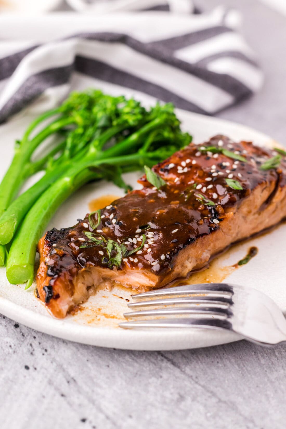 Teriyaki Salmon on a plate with a piece taken out