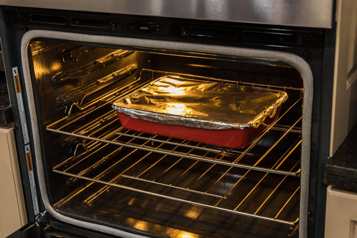 boneless beef short ribs in the oven covered with aluminum foil
