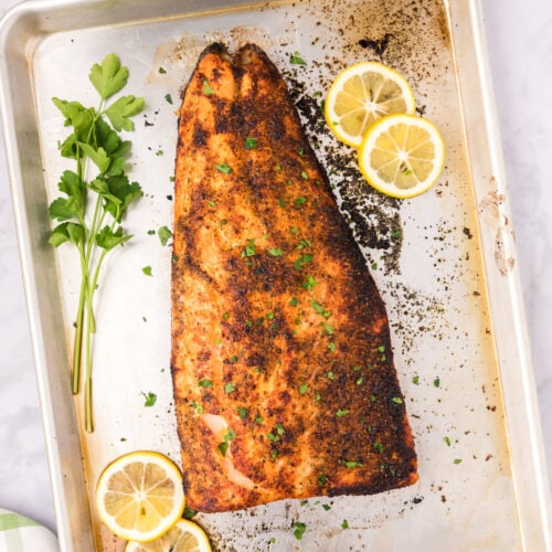 Broiled Salmon on a sheet pan with lemon slices