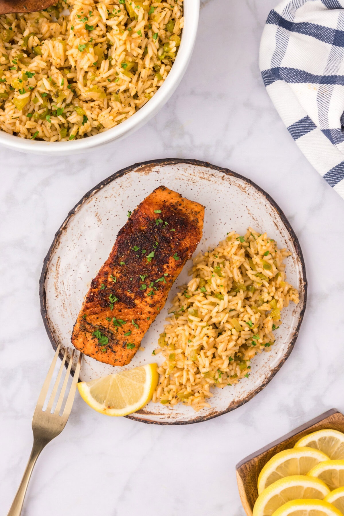 Cajun Rice on a plate with cajun salmon