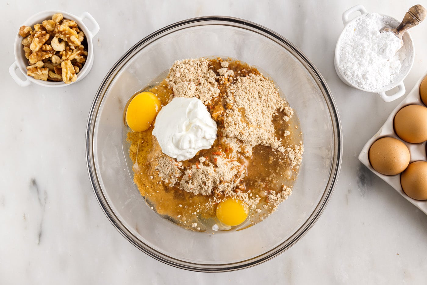 eggs, oil, carrot cake mix, and sour cream in a mixing bowl