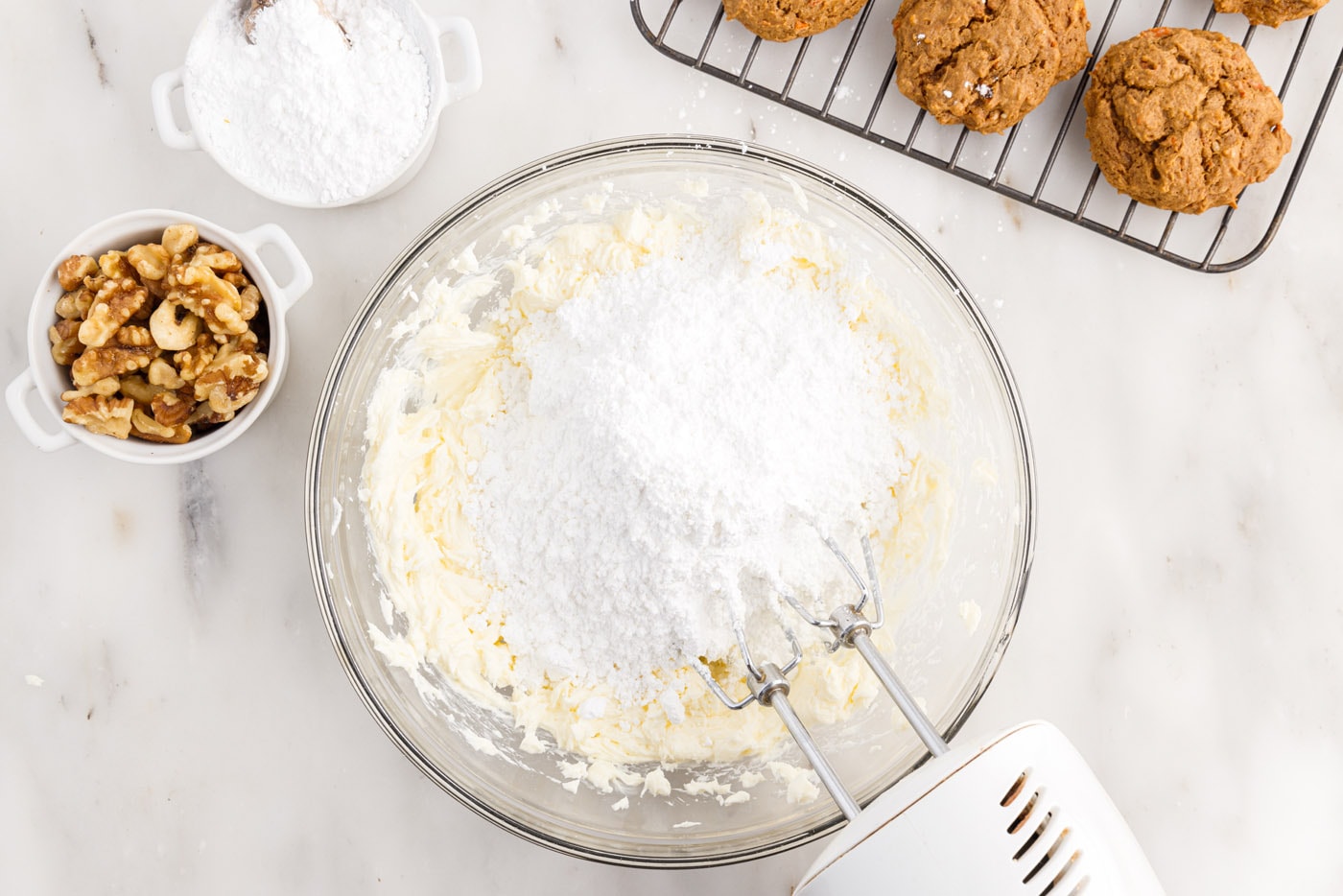 powdered sugar added to cream cheese and butter mixture