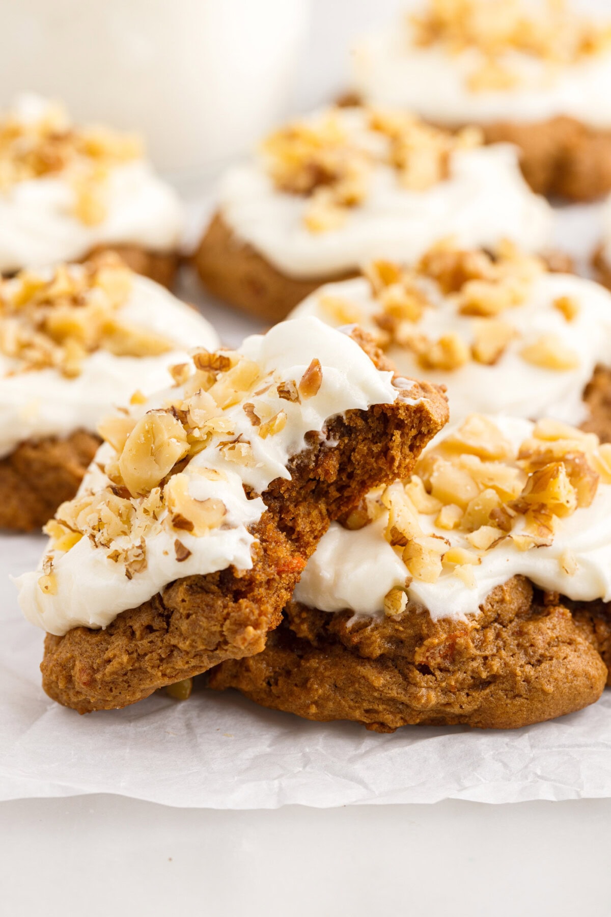 Carrot Cake Mix Cookie with a bite taken out resting on another Carrot Cake Mix Cookie