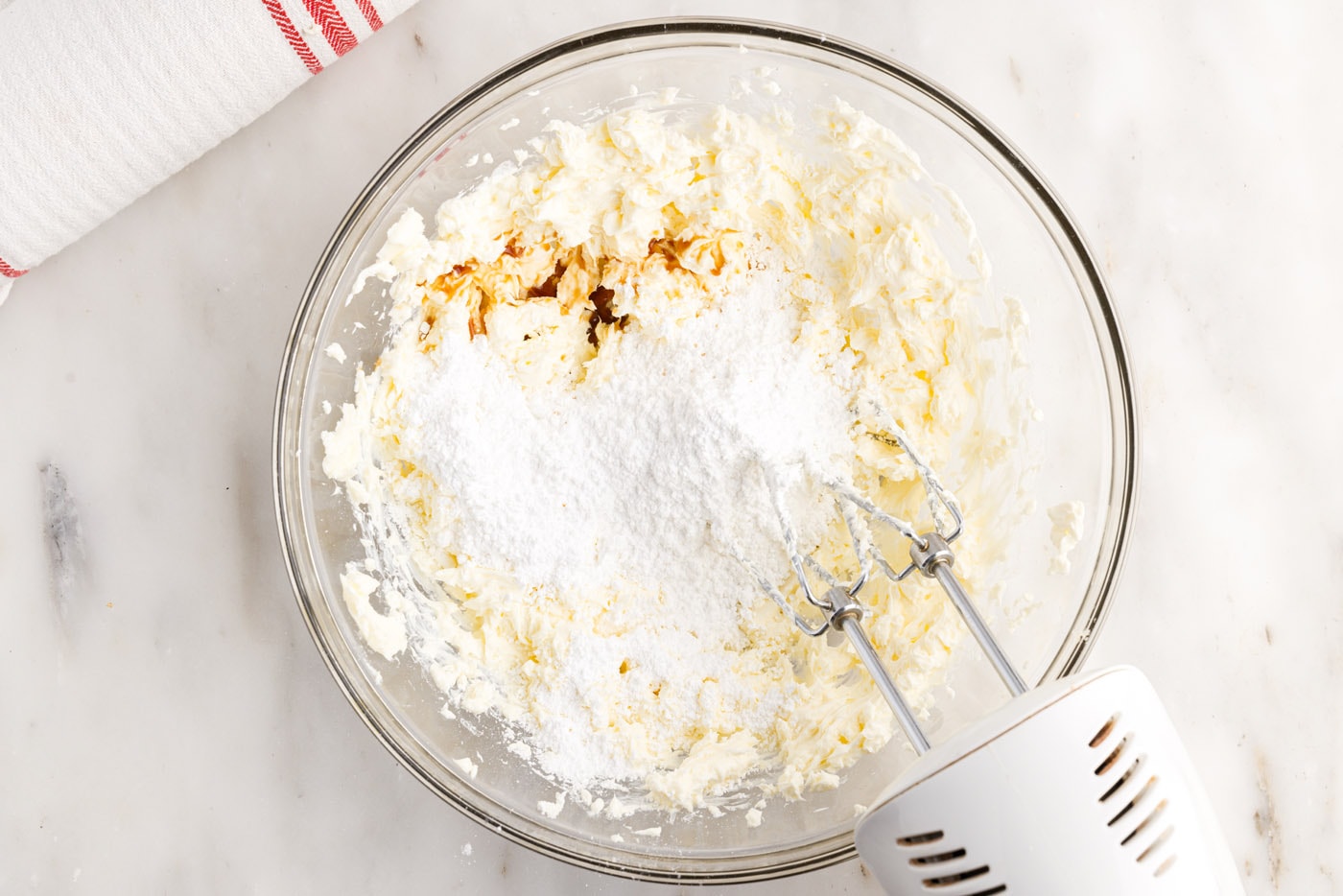 vanilla and powdered sugar added to cream cheese mixture