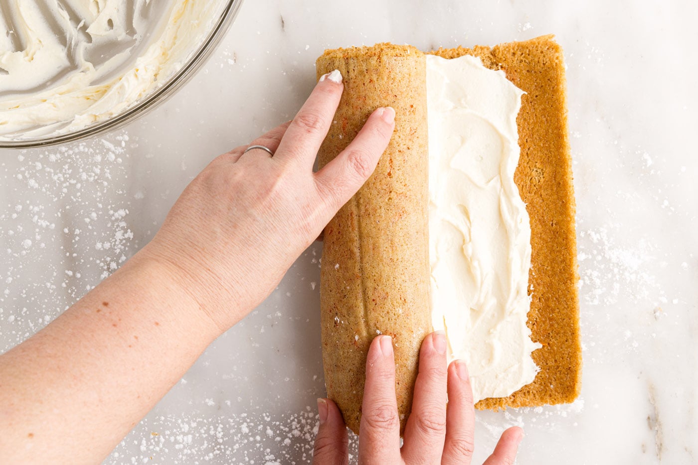 rolling carrot cake roll with cream cheese filling