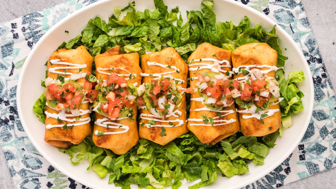 These easy cheesy chicken chimichangas come together in 15-20 minutes and make the perfect leftovers