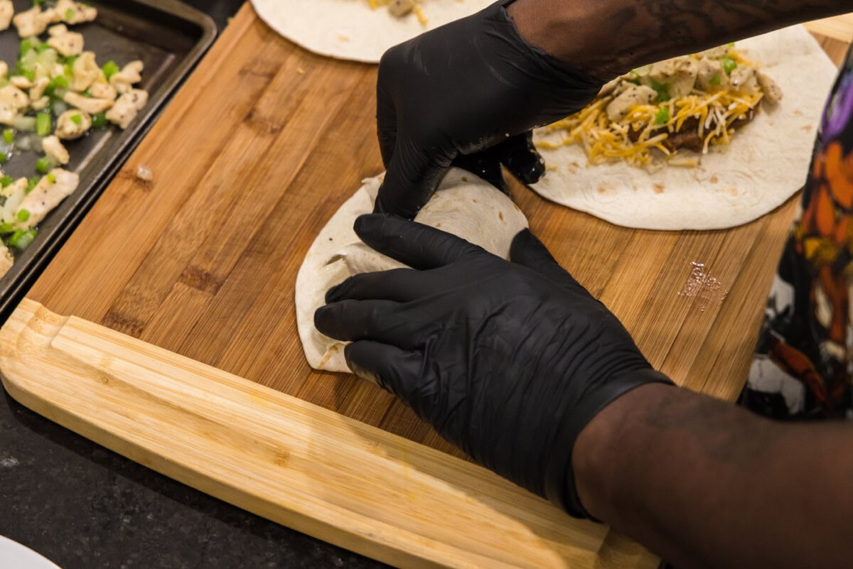 folding the sides of a chimichanga