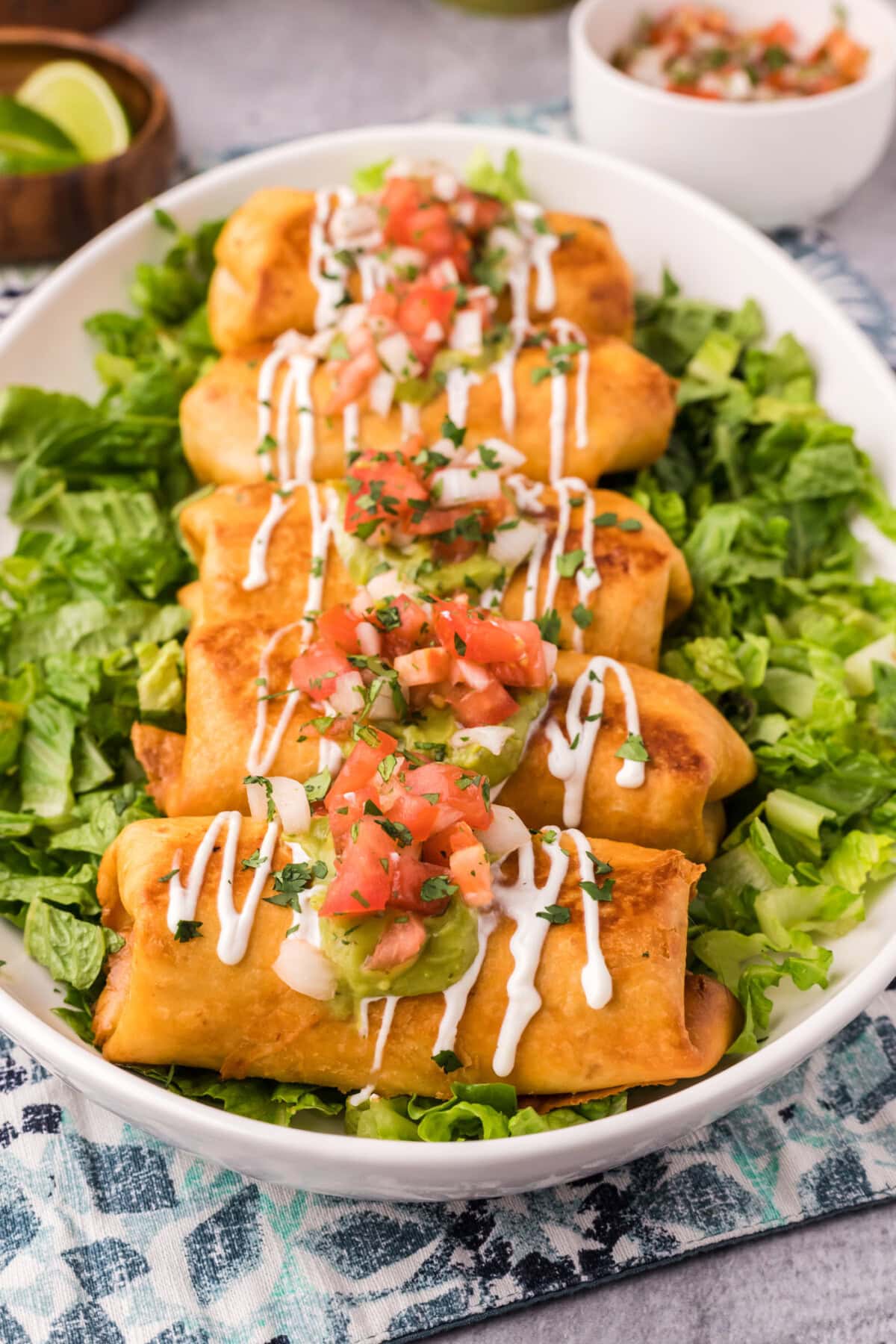 Chimichangas served over a bed of lettuce