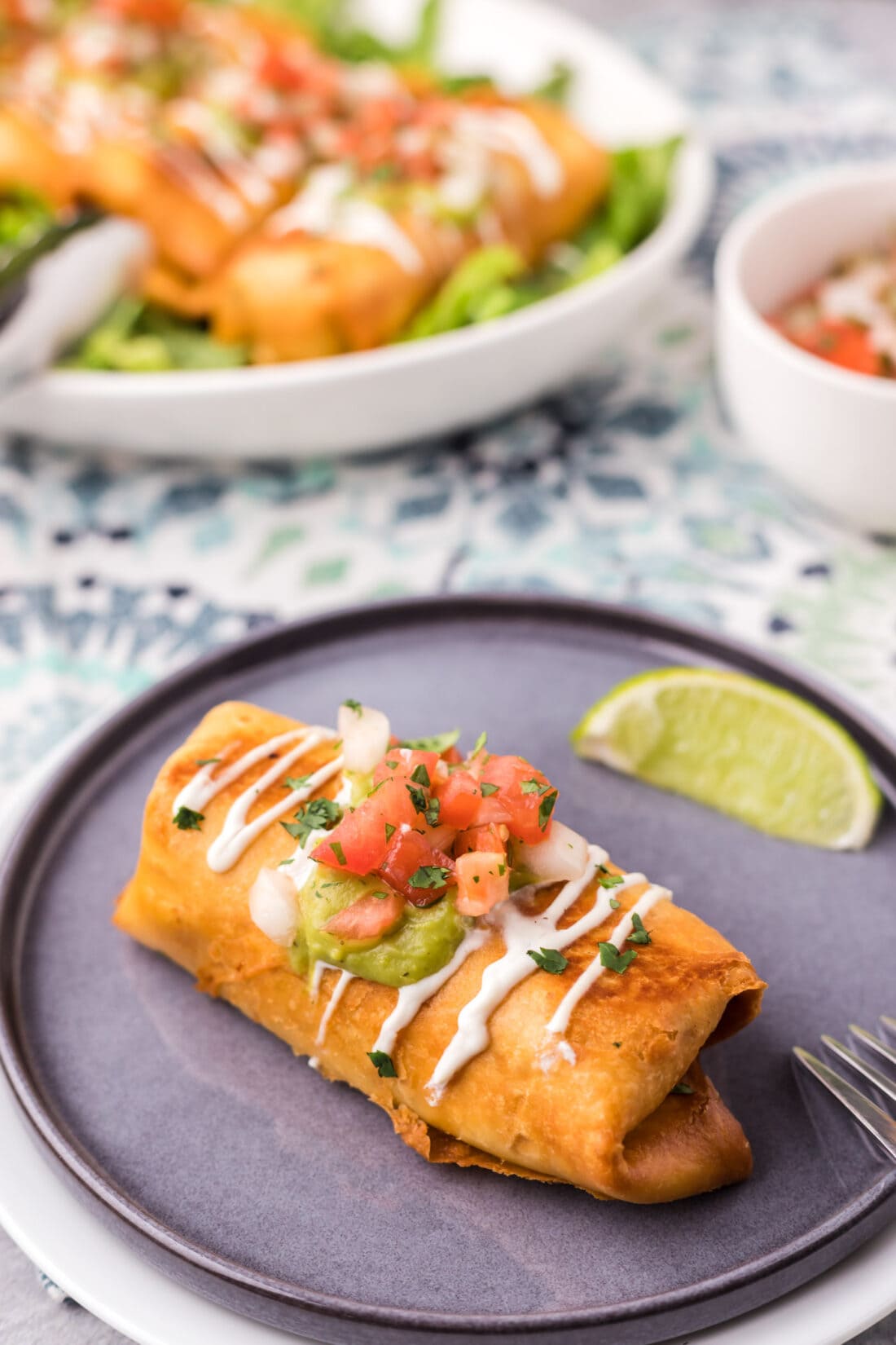 Chimichanga on a plate with a lime wedge