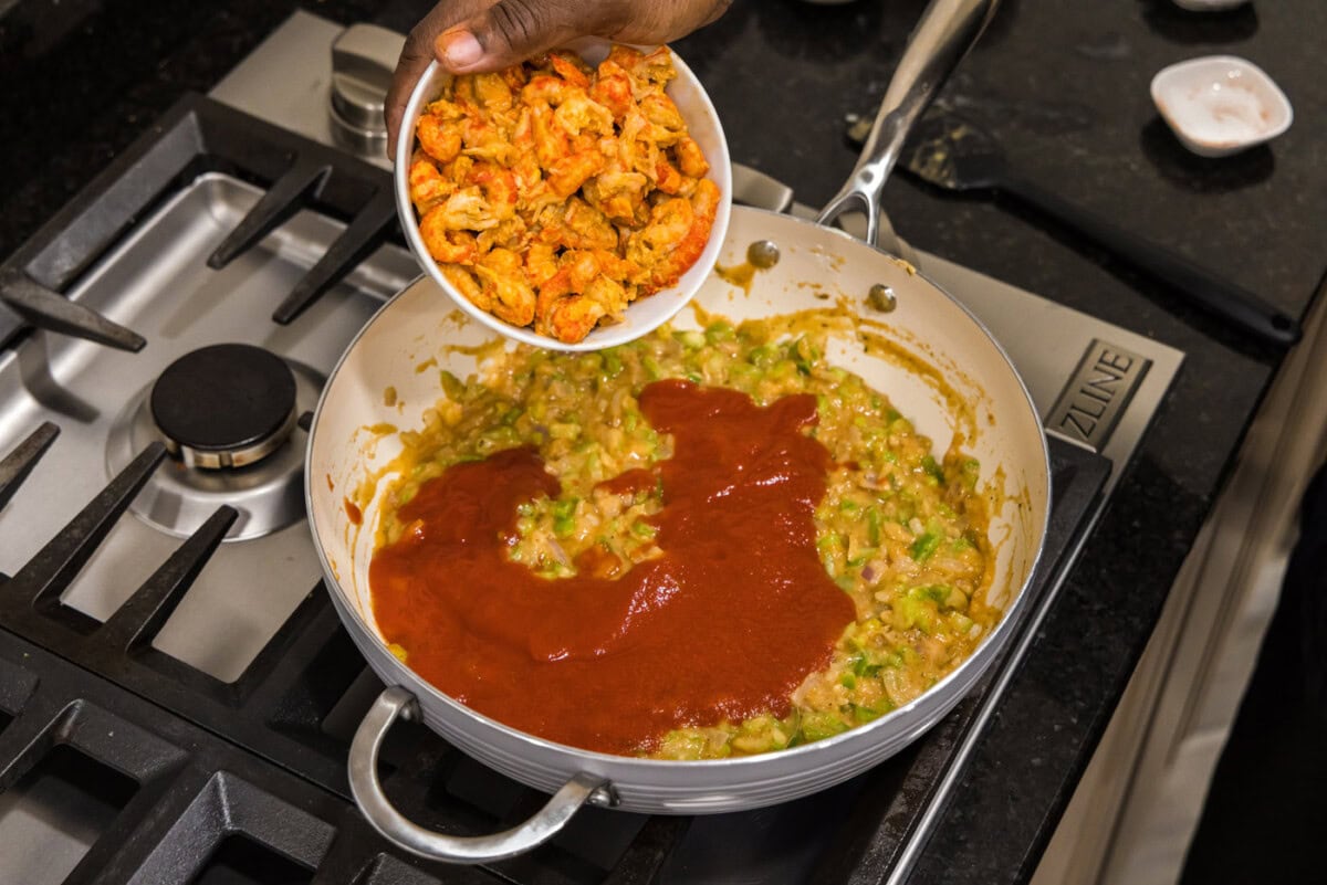adding crawfish to skillet for crawfish etouffee