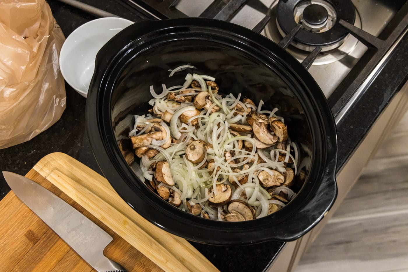 mushrooms and onions in a slow cooker