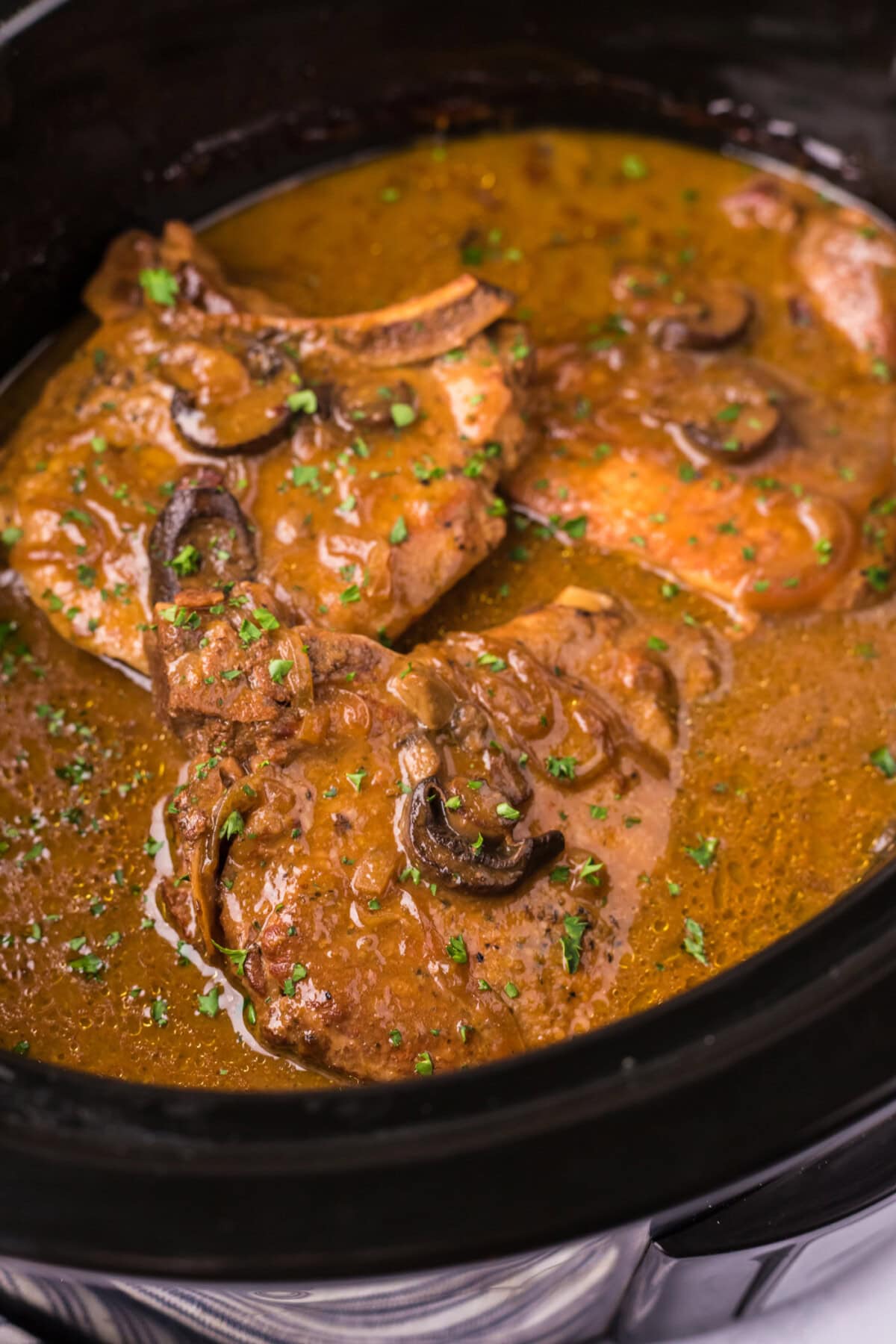 Close up photo of Crockpot Pork Chops in a crockpot