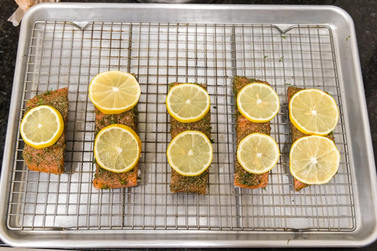 lemon slices on top of dill salmon