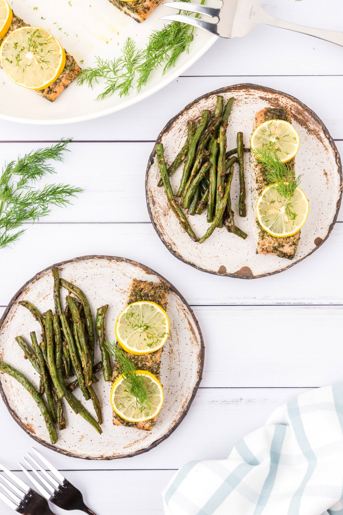 Two plates of Dill Salmon and green beans