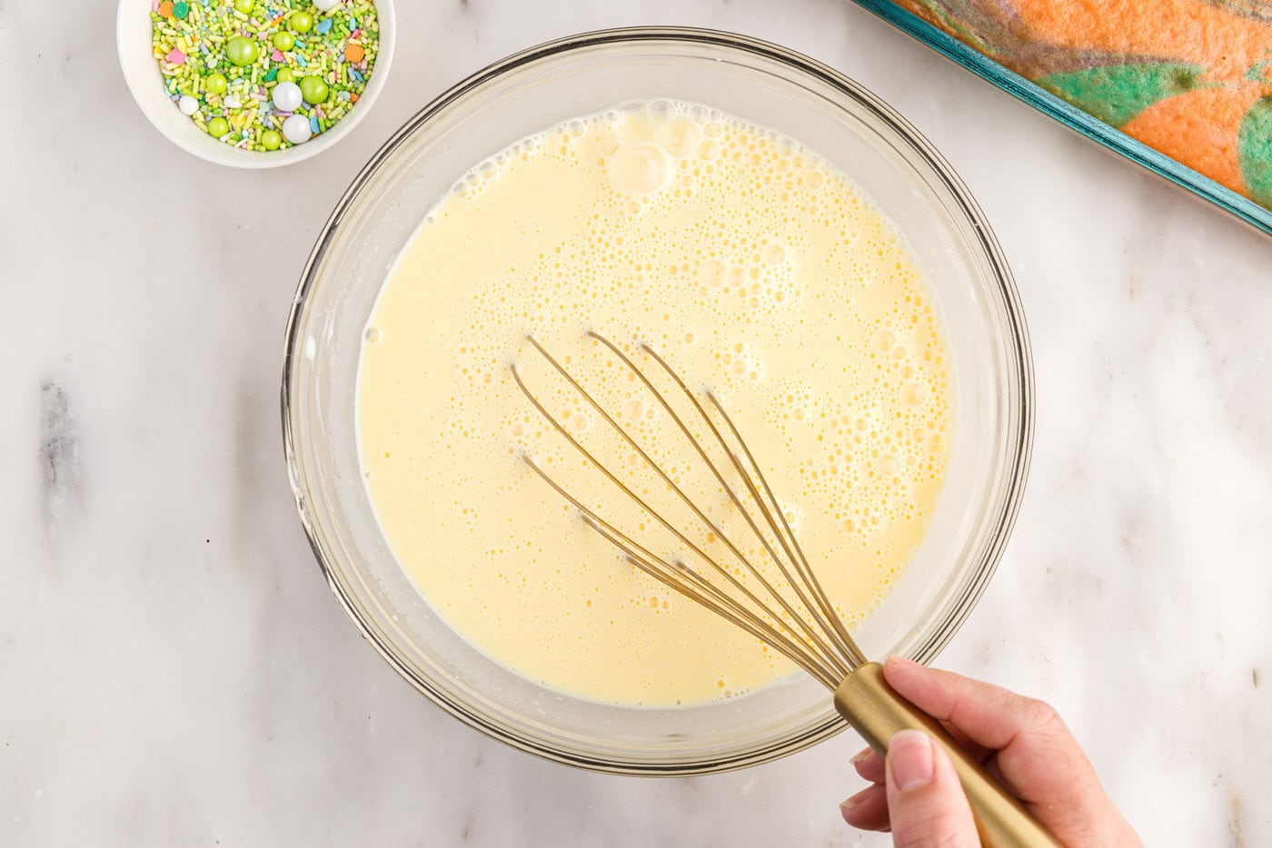 whisking instant vanilla pudding in a bowl