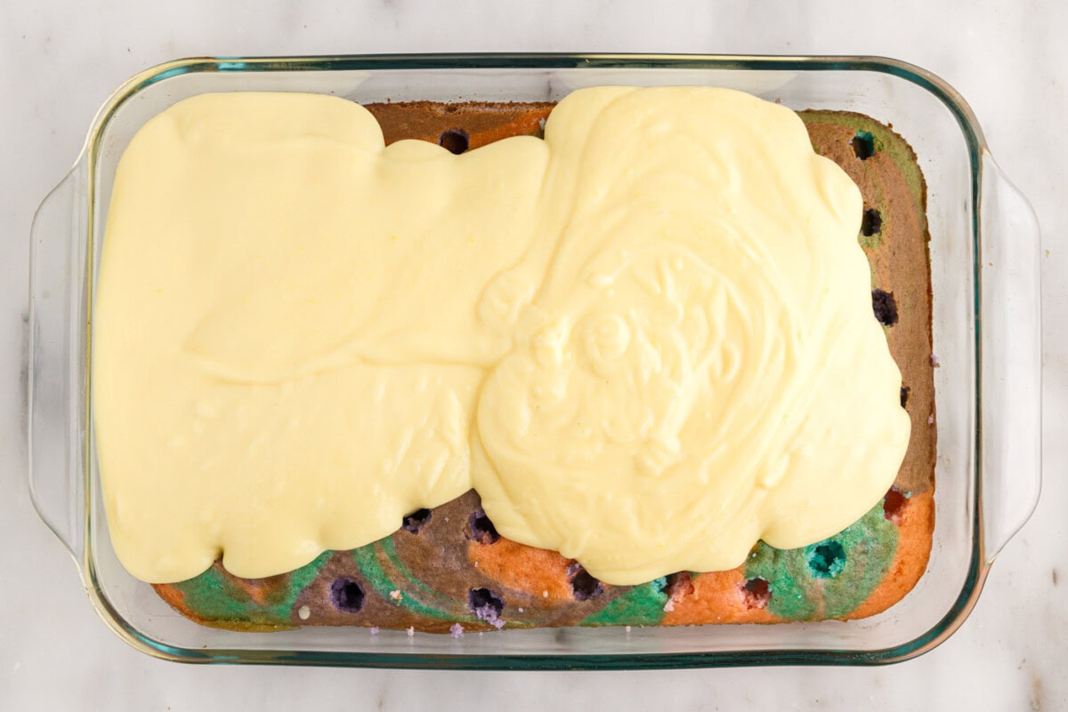 vanilla pudding on top of poke cake