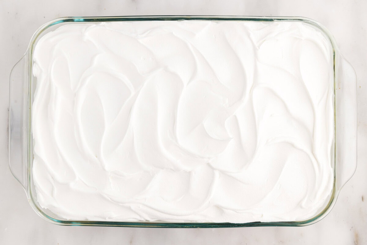 swirled cool whip on top of cake