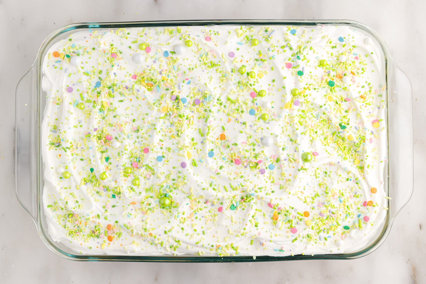 easter poke cake with colorful sprinkles
