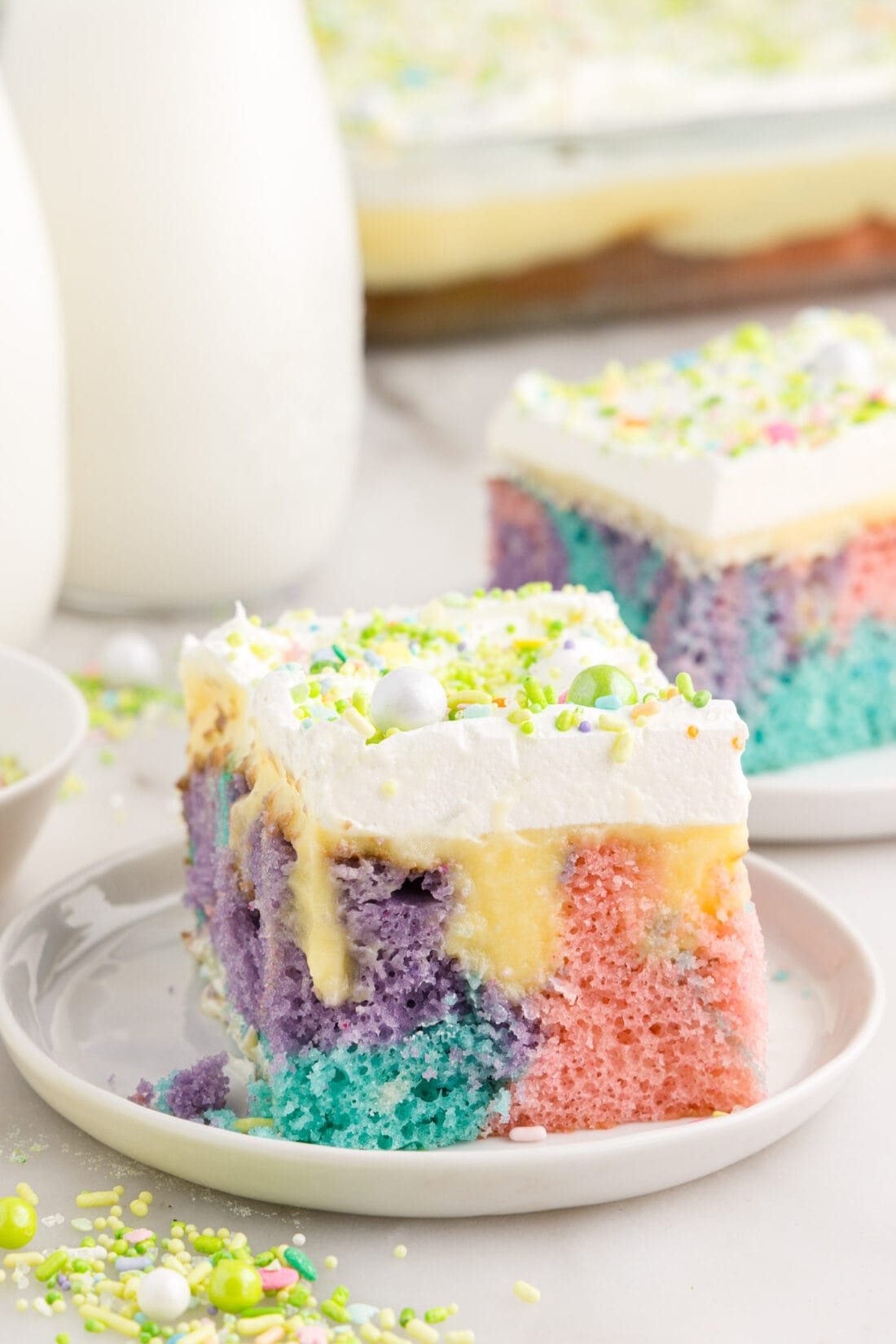 Slice of Easter Poke Cake on a plate